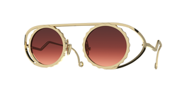 Admirez le design moderne et luxueux des lunettes Gamine x Persta, en titane doré pour un look chic. Admire the modern and luxurious design of Gamine x Persta glasses, with gold-plated titanium for a chic look